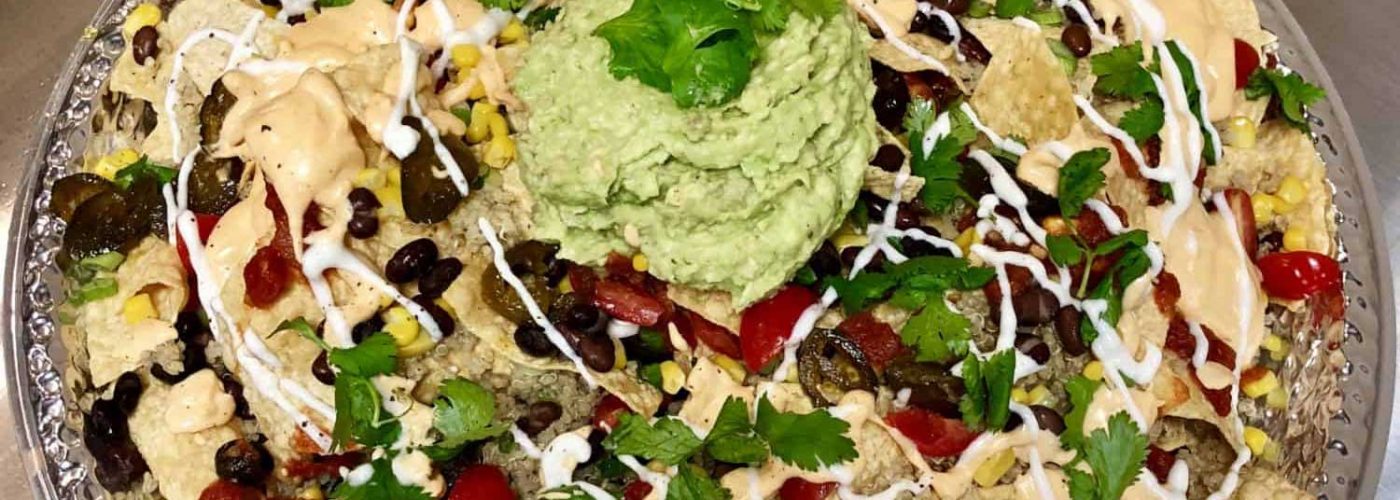 Plant-Based Nachos with Cashew Cheese Sauce, Guacamole and Cashew Sour Cream